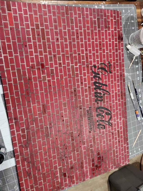 Brick wall with paint drying.